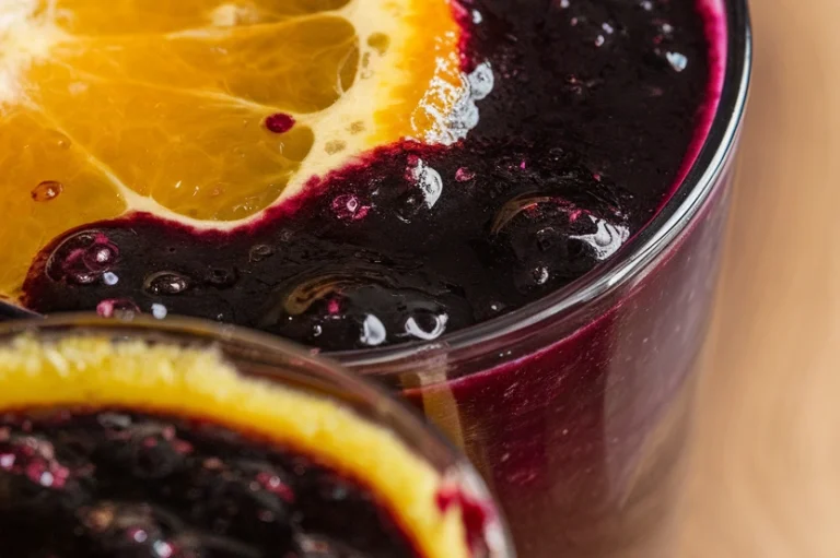 Orange and Black Layered Smoothies - Featured Image